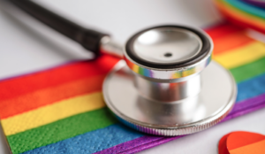 a stethoscope and LGBT flag