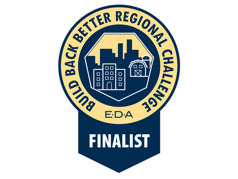 Finalist badge for the Build Back Better Regional Challenge by EDA, featuring city skyline and buildings icon.