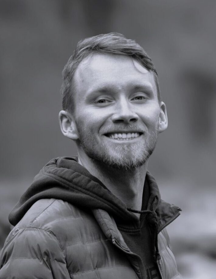 Headshot of Erik Anderson smiling in black and white