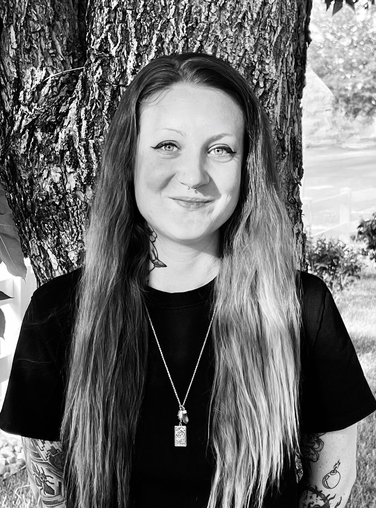 Headshot of Erin Carelton smiling in black and white