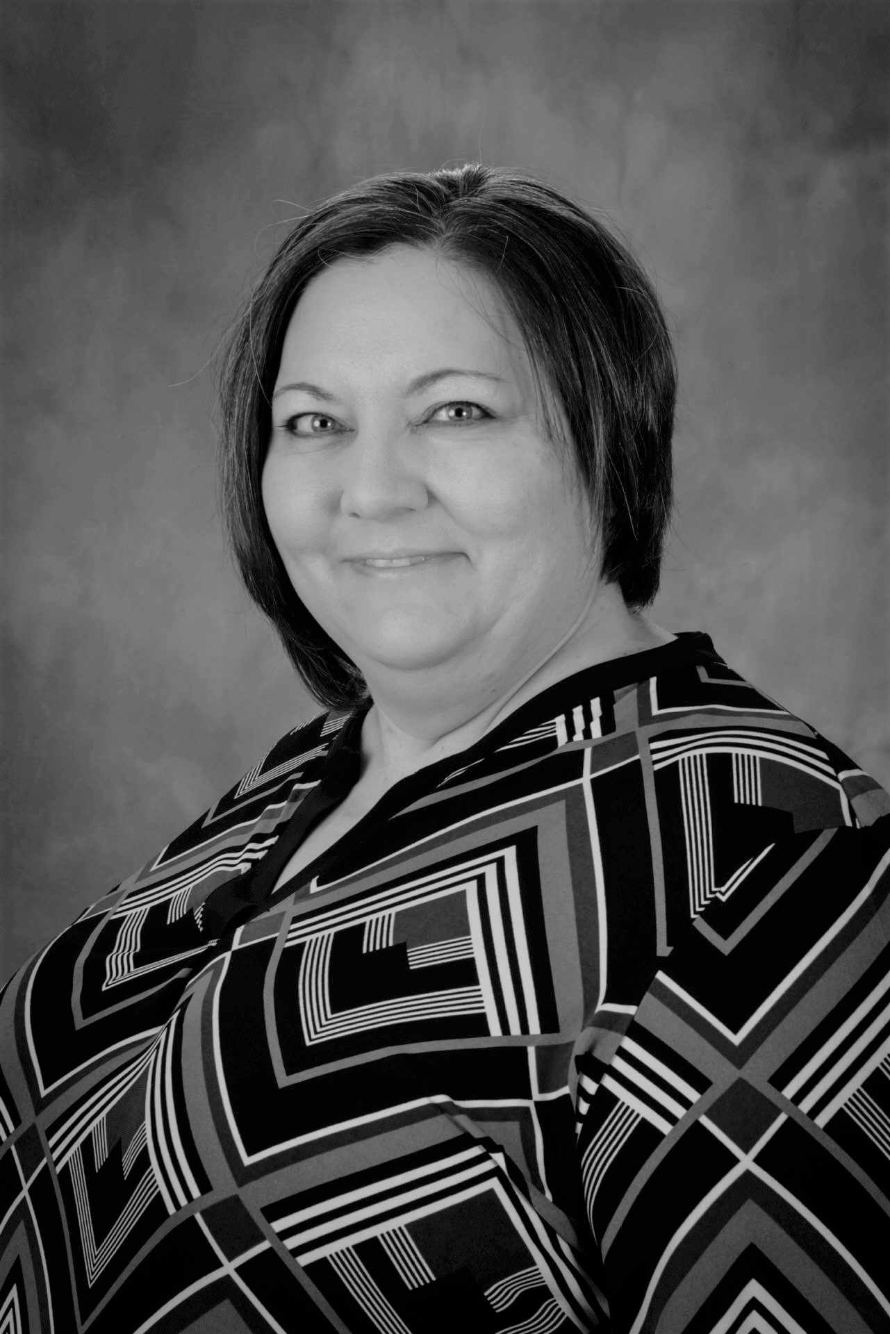 Headshot of Melinda Spivey smiling in black and white