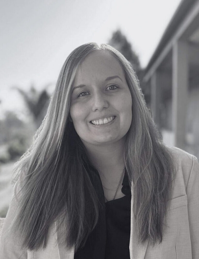 Headshot of Kayla Foote smiling in black and white
